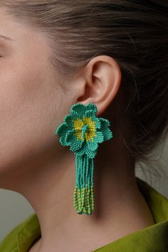 Big Beaded Flower Earrings with Long Tassel Fringe Earrings This summer, make it a memorable one with these carefully handmade colourful bead flowers. All made with attention to detail, this design is sure to captivate any onlooker. Wear it with summer dresses, linen suits or even bikini while enjoying the carefree summer breeze. Big Floral, Earrings Bead, Earrings Big, Long Fringe, Earrings Bridesmaid, Long Fringes, Jewelry Design Earrings, Earrings Beaded, Big Flowers