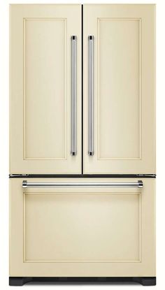 a white refrigerator freezer sitting inside of a kitchen next to a wall mounted oven