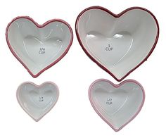 three heart shaped bowls with measurements on them