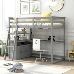 a loft bed with desk underneath it in a child's bedroom or playroom