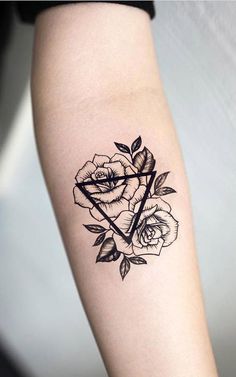 a rose and triangle tattoo on the arm