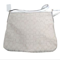 Signature jacquard with smooth leather detailsZip-top closure, fabric liningOutside slip pocketAdjustable strap with 21 3/4" drop for shoulder or crossbody wear10 1/4" (L) x 8 3/4" (H) x 2" (W)This bag is NWOT Formal White Bags With Leather Trim, White Bags With Leather Trim For Formal Occasions, Coach Crossbody Shoulder Bag, White Formal Bag With Leather Trim, Formal Coach Shoulder Bag With Leather Trim, Coach Shoulder Bag With Adjustable Strap For Errands, Coach Hobo Bag With Adjustable Strap For Travel, Coach Hobo Bag With Adjustable Strap For Errands, White Leather Trim Formal Bag