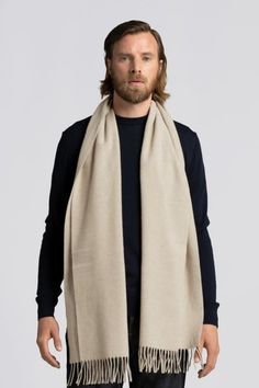 The ultimate fall-winter accessory remastered: Our classic scarf is now woven from 100% recycled wool, increasing the share of cashmere from 10% to 45% for even greater comfort. With the luxurious warmth of wool and incomparable softness of cashmere, you'll be begging summer to stay away. Luxury Shawl Collar Cashmere Sweater, Luxury Cashmere Shawl Collar Sweater, Cashmere Hats For Men, Luxury Gray Scarf For Winter, Luxury Gray Scarves For Winter, Luxury Beige Winter Scarves, Luxury Merino Wool Sweater With Shawl Collar, Luxury Beige Shawl For Winter, Luxury Fall Cashmere Hat