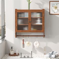 Description: Timeless Vintage Style: This kitchen wall cabinet embodies vintage home charm with its clean lines and minimalist design, enhancing your personal taste and complementing any interior decor with its rich brown color. Exceptional Material Choice: Featuring long iris glass with good craftsmanship, this wall cabinet is rust-proof and resistant to corrosion and wear. The fluted glass design allows for excellent light transmission, elevating your high-end home decor. Versatile Storage Solution: Designed with a 3-tier double door cabinet, this bathroom wall cabinet offers ample storage space, helping you stay organized for daily use, with each tier capable of supporting up to 5 kg/11 lbs. Adjustable Shelving: The removable shelves inside this bathroom cabinet wall mount allow for fle Fluted Glass, Material Selection, Bathroom Wall Cabinets, Cabinet Shelving, Pantry Cabinet, Double Door, Wall Storage, Door Wall, Wood Accents