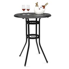 a small table with two wine glasses on it