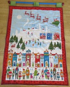 a quilted christmas scene with santa's sleigh and reindeer on it