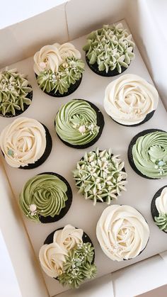 twelve cupcakes in a box decorated with green and white frosting, on top of each other