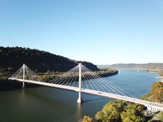 an aerial view of a bridge over a river