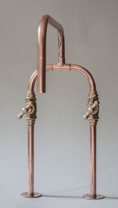 an old fashioned faucet with two handles and nozzles on the side