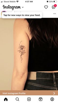 a woman with a flower tattoo on her arm