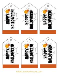 four tags with the words halloween on them and an image of a spider crawling through it