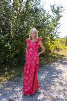 Things we love about the Copeland Dress, a list: Flutter sleeves. A flattering tiered skirt. Pockets! And the bold raspberry red floral with pops of pink and citrus hues. The maxi-length dress stuns on its own, but we love it paired with a cropped jacket—denim and leather both work great. Details Red floral print Pockets Maxi dress 100% cotton fabric Fit Notes Jacklene takes a S in this style Care Instructions Machine wash cold Gentle cycle Do not bleach Lay flat to dry Iron low Shipping Ships in 3 to 5 business days Pink Tiered Maxi Dress With Ruffles, Pink Ruffle Hem Sundress Maxi Dress, Pink Maxi Dress With Ruffle Hem For Vacation, Pink Ruffle Hem Maxi Sundress, Vacation Maxi Dress With Ruffle Sleeves, Red Ruffle Hem Maxi Dress For Vacation, Flutter Sleeve Maxi Sundress For Garden Party, Red Tiered Sundress Maxi Dress, Pink Bohemian Dress With Ruffle Sleeves