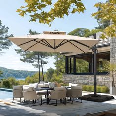 an outdoor dining area with table, chairs and umbrella