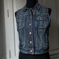 New Without Tags. Express Jeans Denim Vest. Has Side Pockets And Two Front Chest Pockets. Pretty Copper Colored Buttons. Clean And Smoke Free Home. Fitted Button-up Casual Denim Vest, Fitted Button-up Denim Vest, Fitted Casual Denim Vest In Medium Wash, Casual Stretch Denim Vest With Pockets, Casual Medium Wash Stretch Denim Vest, Casual Stretch Denim Vest In Medium Wash, Casual Stretch Denim Vest In Dark Wash, Casual Stretch Dark Wash Denim Vest, Casual Fitted Denim Vest With Buttons