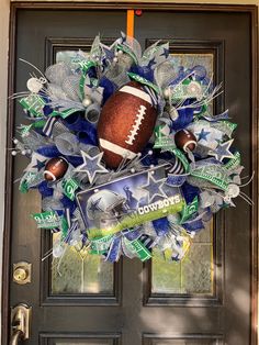 a football wreath is hanging on the front door