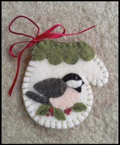 a felt ornament with a bird on it