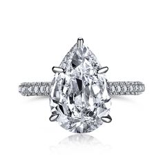 a pear shaped diamond ring with diamonds around it