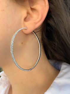 "✦ DESCRIPTION ✦ Unlike the classic diamond eternity design, half of the \"in-out\" or \"front facing\" eternity single earring form Sioro Silver has Simulated diamonds on its inner surface, while the other half has hand set stones on its outer surface , this makes these hoop earrings glisten inside and out. Available in 14K yellow gold / White/ Black Rhodium over sterling silver. Hinged posts with vault safety locks. Inside-outside Simulated diamond hoop earrings. -STAMPED 925 -CZ SUPER QUALITY Luxury Cubic Zirconia Hoop Earrings With Sparkling Stones, Luxury Halo Hoop Earrings For Women, Affordable Hypoallergenic Round Earrings, Luxury Hoop Earrings With Sparkling Cubic Zirconia, Affordable White Gold Plated Earrings, Luxury Round Sterling Silver Hoop Earrings, Luxury Hoop Earrings With Single Diamond In Cubic Zirconia, Luxury Halo Round Cut Hoop Earrings, Luxury Modern Round Cut Hoop Earrings