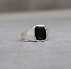 This meticulously crafted signet, featuring a polished cushion-shaped black onyx, combines the timeless appeal of vintage aesthetics  with a sleek modern design, making it an ideal and thoughtful gift for you or your loved one. Great as an Gift for a Men, Musician, Guitarist, Skater or Modern Fashion enthusiast High polished outside and inside Available in all sizes Ring from the picture is : 10US size Top Plate : 14x12mm Onyx : 12x10mm Side thickness: 2mm Bottom thickness ~ 1.8mm Side and botto Modern Black Enamel Signet Ring For Anniversary, Modern Black Enamel Rings For Gifts, Classic Black Enamel Signet Ring As Gift, Black Jewelry With Polished Edges For Gift, Black Rings With Polished Edges For Gifts, Black Signet Ring With Polished Finish Gift, Black Sterling Silver Rectangular Signet Ring, Classic Black Signet Ring With Polished Edges, Modern Black Signet Ring With Polished Edges