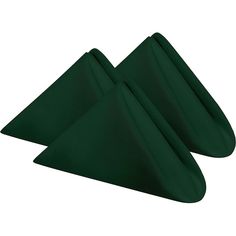 two dark green napkins folded in the shape of three pyramids on a white background