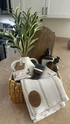 a basket filled with personal care items sitting on top of a counter next to a potted plant