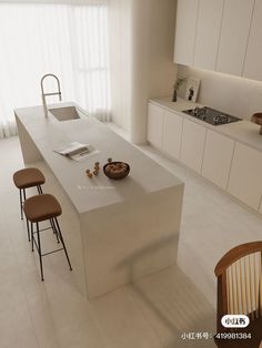 a modern kitchen with an island counter and bar stools