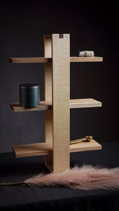 the shelf is made out of wood and has two shelves on each side, one with a candle