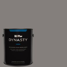 a paint can with the words dynastiy painted in blue and black on it