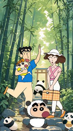 a man and woman are standing in the woods with pandas