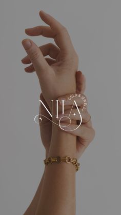 two hands holding onto each other with the word nia on it