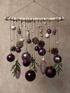 an assortment of christmas ornaments hanging from a rack