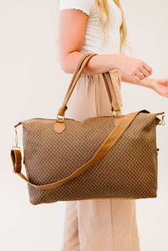 Did someone say must-have bag? The Olivia weekender is an absolute essential in every woman's closet. the timeless patterns, buttery smooth vegan leather, and versatile straps make it a top contender for the title of the perfect travel bag. Details: 26" long x 15" height x 7" wide Detachable strap adjusts to 42" long Gold hardware 3 interior pockets, including 1 with a zipper Perfect Travel Bag, Leather Weekender Bag, Leather Weekender, Womens Closet, Leather Duffle Bag, Travel Bags For Women, Convertible Backpack, Leather Duffle, Travel Duffel