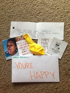 a piece of paper that says you're happy on it with pictures and notes attached to it