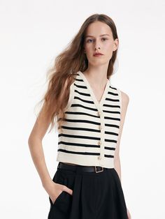 -Lyocell -V-neck -Workwear This vest cardigan is crafted from a soft fabric with a delicate texture, features a V-neck that accentuates the neckline. Metal buttons which make it easily wear, add sophistication. The classic black and white stripes are timeless and perfect for everyday wear. It can be worn with pants or shorts for a simple, sophisticated look.Knit Striped V-Neck Vest CardiganGoodsNo: 1C4C6H010• Fit Type: Fit• Elastic: Non-elastic• Thickness: ModerateMaterials37%Lyocell32%Polyamide Woolen Dresses, Vest Cardigan, Striped Vests, Summer Work Outfits, A Line Shorts, Black And White Stripes, Long Sleeve Short Dress, Cardigan Vest, Short En Jean