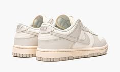 The Women’s Nike Dunk Low “Light Bone” is an inherently vintage, two-tone, white-and-grey colorway of the women’s sizing of the retro basketball shoe by Nike.  Inadvertently, the “Light Bone” mimics the look of many Dunk colorways found in Off-White and Nike’s “Lot 50” collection from August 2021.  Like “Lot 50,” the “Light Bone” features a simple, easy-to-wear color palette and subtle vintage-inspired details.  Here, Sail leather appears on the perforated toe, mid-panel, collar, and heel.  The Dunk Low Light Bone, Nike X Travis Scott, Retro Basketball Shoes, Low Air Jordan 1, Jordan 8, Baskets Nike, Dunks Nike, Jordan 2, Nike Dunk High