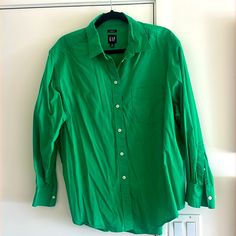 Brand New. Never Worn Kelly Green Button Down Shirt. Size Medium Classic Gap Tops For Spring, Gap Cotton Button-up Blouse, Classic Gap Cotton Blouse, Gap Relaxed Fit Top With Button Closure, Classic Cotton Blouse By Gap, Gap Tops With Button Closure And Relaxed Fit, Spring Gap Shirt With Button Closure, Gap Summer Workwear Shirt, Gap Shirt For Summer Workwear