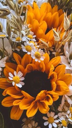 a bunch of flowers that are sitting on a table