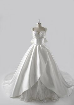 a white wedding dress on a mannequin