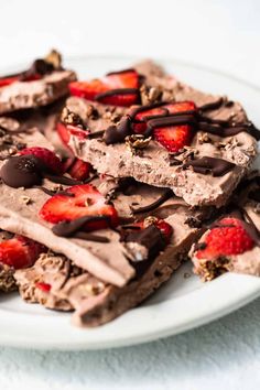 a plate topped with chocolate and strawberries