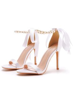 Our signature Unique Pearls Sandal stands out with its two graceful bow accents and an eye-catching stiletto heel. This contemporary yet classic design is carefully hand-crafted from the highest quality smooth leather, guaranteeing both style and durability. The Unique Sandal is an ideal choice for enhancing cropped hemlines, adding sophistication to a midi wedding dress for the bride-to-be, or elevating your style at any special occasion. Make a lasting impression at your next event with this e Midi Wedding Dress, Blazers Shoes, Plus Size Cosplay, Pearl Sandals, Floral Two Piece, Short Lace Dress, Sneaker Slippers, Printed Long Dresses, Dress For Short Women