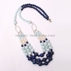 "Product Details : ITEM : AQUAMARINE, LAPIS LAZULI, PEARL BEADED NECKLACE Item Code : DGC2539 Gemstone Name : AQUAMARINE, LAPIS LAZULI, PEARL Chain Style : BEADED Beads Shape : Smooth Round/Rondelle Beads Size : 6mm/7mm/10mm/12 mm Approx Length : 24\"-26\" Inch Approx Weight : 530 Cts. Approx Customization : **Available** Please Feel Free To Contact If You Have Any Query." Elegant Blue Gemstone Bead Crystal Necklace, Elegant Blue Crystal Necklaces With Gemstone Beads, Elegant Blue Beaded Necklace With Gemstone Beads, Blue Bohemian Pearl Necklace With Gemstone Beads, Bohemian Blue Pearl Necklace With Gemstone Beads, Light Blue Gemstone Beads For Jewelry Making, Blue Natural Stones Round Necklace, Elegant Blue Beaded Necklaces With Natural Stones, Blue Necklaces With Natural Stones