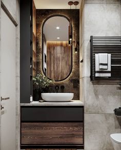 a bathroom with a sink, mirror and towel rack on the wall next to it