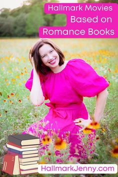 a woman in a pink dress is posing with books