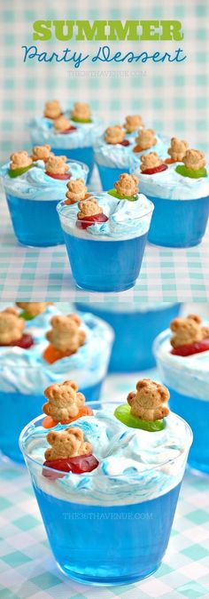 blue dessert cups filled with cookies and frosting on top of a checkered table cloth