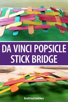 popsicle stick bridge made with construction paper and colored clothes pins on top of it