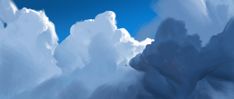 an abstract painting of clouds and blue sky