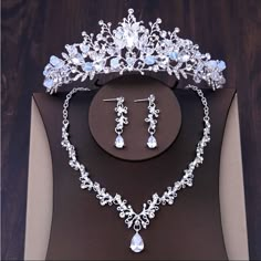 a tiara and earrings on display in a box