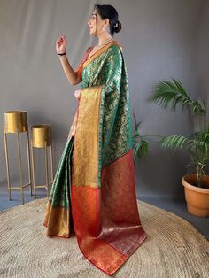 Elevate your style with our mesmerizing green zari weaving silk traditional saree with blouse. This stunning saree is made from high-quality silk material in a vibrant green color, adorned with intricate zari weaving work. The matching pink blouse also features the same zari weaving work, making it a perfect complement to the saree.
This 5.50 meters saree and unstitched blouse material is perfect for any occasion, whether it's a festival, function, or wedding. The rich green color and detailed z Green Pre-draped Saree With Meenakari For Puja, Festive Green Pre-draped Saree With Zari Weaving, Festive Green Pre-draped Saree With Pallu, Green Bollywood Pre-draped Saree With Meenakari, Green Semi-stitched Pre-draped Saree With Meenakari, Green Paithani Silk Pre-draped Saree With Self Design, Green Pre-draped Saree With Zari Weaving For Diwali, Festive Green Pre-draped Saree With Self Design, Green Pre-draped Saree With Self Design For Diwali