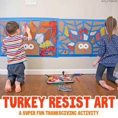 two children playing with turkey rest art on the floor