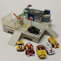 a group of toy cars sitting next to each other